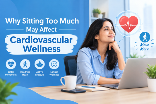 Person sitting for long hours at a desk while highlighting the importance of movement and cardiovascular wellness