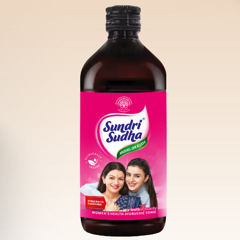 Sundri Sudha bottle with pink label on a beige background